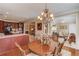 Dining room open to kitchen and living room, featuring hardwood floors at 836 Windsor Place Ct, Grayson, GA 30017