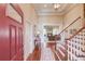Grand foyer with hardwood floors, staircase, and view into the living room at 836 Windsor Place Ct, Grayson, GA 30017