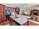 Kitchen with breakfast bar featuring a stainless sink and black appliances at 836 Windsor Place Ct, Grayson, GA 30017