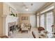Cozy living room featuring fireplace and access to patio through french doors at 836 Windsor Place Ct, Grayson, GA 30017