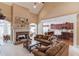 Cozy living room with fireplace, vaulted ceilings, and open flow to the kitchen at 836 Windsor Place Ct, Grayson, GA 30017
