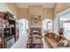 Comfortable living room with vaulted ceilings, fireplace, and large windows at 836 Windsor Place Ct, Grayson, GA 30017
