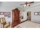 Spacious main bedroom suite features a large armoire and ensuite bathroom at 836 Windsor Place Ct, Grayson, GA 30017