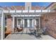 View of patio area with access to home through French doors and beautiful landscaping at 836 Windsor Place Ct, Grayson, GA 30017
