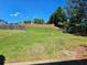 Large backyard with a new fence and mature trees for outdoor privacy at 1021 Rock Elm Dr, Auburn, GA 30011