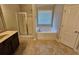 Bathroom features a shower and a separate tub with a window at 1021 Rock Elm Dr, Auburn, GA 30011