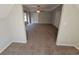 Spacious bedroom featuring carpeted floor, base trim, ceiling fan and natural light at 1021 Rock Elm Dr, Auburn, GA 30011