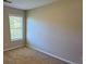 Bedroom features a window, carpet flooring and neutral color walls at 1021 Rock Elm Dr, Auburn, GA 30011
