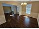 Dining room featuring hardwood floors, modern lighting, and wainscoting at 1021 Rock Elm Dr, Auburn, GA 30011