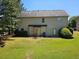 Expansive backyard with lush green grass and mature trees offers plenty of outdoor space at 1021 Rock Elm Dr, Auburn, GA 30011