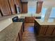 Kitchen featuring granite countertops, stainless steel appliances, and dark cabinets at 1021 Rock Elm Dr, Auburn, GA 30011