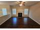 Cozy living room with fireplace and many windows for lots of natural light at 1021 Rock Elm Dr, Auburn, GA 30011