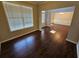 Spacious Living room featuring hardwood floors, modern lighting, and natural light at 1021 Rock Elm Dr, Auburn, GA 30011