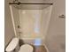 White shower and tub combo perfect for relaxation and cleanliness in the home bathroom at 1021 Rock Elm Dr, Auburn, GA 30011