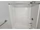 Bright and clean white tiled shower with updated fixtures at 1021 Rock Elm Dr, Auburn, GA 30011