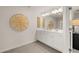 Elegant bathroom featuring double vanity, decorative mirror, and tiled floor at 1029 Merritt Dr # 97, Villa Rica, GA 30180