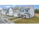 New townhomes feature colorful exteriors, front lawns, garages, sidewalks, and professional landscaping for curb appeal at 1029 Merritt Dr # 97, Villa Rica, GA 30180