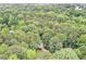 Aerial view showcasing the home's lush, green surroundings and landscaped grounds at 1879 Beaver Dam Ne Ln, Marietta, GA 30062