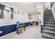 Finished basement area with carpeted stairs and a play area at 1879 Beaver Dam Ne Ln, Marietta, GA 30062