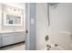 Bathroom featuring tiled shower and tub, plus large vanity at 1879 Beaver Dam Ne Ln, Marietta, GA 30062