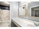 Bathroom with tiled shower, spacious vanity, and sleek fixtures at 1879 Beaver Dam Ne Ln, Marietta, GA 30062