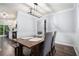 Elegant dining room with a wooden table, chair set, and modern lighting at 1879 Beaver Dam Ne Ln, Marietta, GA 30062