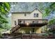 Charming two-story home with a spacious wooden deck overlooking a beautifully landscaped backyard at 1879 Beaver Dam Ne Ln, Marietta, GA 30062