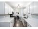 Modern kitchen with white cabinets, stainless steel appliances, and sleek countertops at 1879 Beaver Dam Ne Ln, Marietta, GA 30062