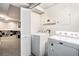 Functional laundry room with bi fold door, and modern appliances at 1879 Beaver Dam Ne Ln, Marietta, GA 30062