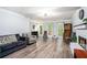 Open-concept living room with hardwood floors, natural light, and a back door access at 1879 Beaver Dam Ne Ln, Marietta, GA 30062