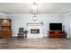 Bright living room with hardwood floors, a fireplace, and comfortable furnishings at 1879 Beaver Dam Ne Ln, Marietta, GA 30062