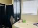 Relaxing bathroom featuring a soaking tub with a black framed shower and a large window at 5814 Highgrove Dr, Atlanta, GA 30349