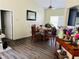 Cozy dining area with a round table, wood-look flooring, and plenty of natural light at 5814 Highgrove Dr, Atlanta, GA 30349