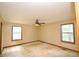 Bedroom with natural light from two windows and neutral walls and ceiling fan at 1112 Mountain Springs Nw Dr, Kennesaw, GA 30144
