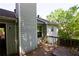 Side view of a weathered wooden deck featuring an exterior door and railing at 1112 Mountain Springs Nw Dr, Kennesaw, GA 30144