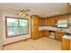 Kitchen with stainless steel appliances, ample cabinetry, a ceiling fan and natural light at 1112 Mountain Springs Nw Dr, Kennesaw, GA 30144