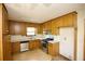 Kitchen featuring oak cabinets, stainless steel appliances, and a corner sink area at 1112 Mountain Springs Nw Dr, Kennesaw, GA 30144