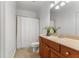 Neutral bathroom with a wood vanity and a shower featuring a white curtain at 1227 Parkside Village Nw Dr, Marietta, GA 30060