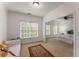 Bright bedroom with attached seating area, two large windows, and neutral decor at 1227 Parkside Village Nw Dr, Marietta, GA 30060