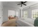 Spacious bedroom featuring a sitting area with a comfortable sofa at 1227 Parkside Village Nw Dr, Marietta, GA 30060