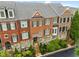 Beautiful townhome exterior with brick facade, stone accents, and well-maintained landscaping at 1227 Parkside Village Nw Dr, Marietta, GA 30060