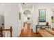 Hallway featuring hardwood floors, with an archway to the living room, and bright white trim at 1227 Parkside Village Nw Dr, Marietta, GA 30060