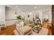 Bright and open living room with hardwood floors and large windows overlooking the entry at 1227 Parkside Village Nw Dr, Marietta, GA 30060