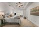 Comfortable main bedroom with tray ceiling, sitting area, and a calming color palette at 1227 Parkside Village Nw Dr, Marietta, GA 30060