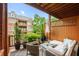 Cozy covered patio featuring comfortable seating and charming garden views at 1227 Parkside Village Nw Dr, Marietta, GA 30060