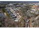 Aerial view of townhome community showing the pool, walking path, and surrounding trees at 124 Everley Walk, Alpharetta, GA 30009