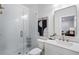 Modern bathroom with white subway tiles, glass shower door, and a sleek white vanity at 124 Everley Walk, Alpharetta, GA 30009