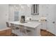 Bright, modern kitchen featuring a spacious island, stainless steel appliances, and ample cabinetry at 124 Everley Walk, Alpharetta, GA 30009