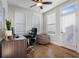 Well-lit home office with a modern desk, comfortable chair, and natural light at 124 Everley Walk, Alpharetta, GA 30009
