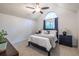 Vaulted ceiling bedroom featuring a ceiling fan and large window with ample natural light at 1100 Ashbury Dr, Decatur, GA 30030
